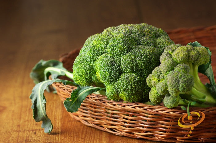 Fresh green Calabrese broccoli seeds from SeedsNow displayed in a clear image with seed packaging and vibrant broccoli florets.