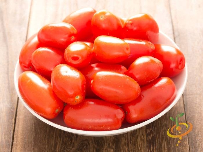 Rio Grande Tomato Seeds (Determinate) | Bowl of bright red, egg-shaped Rio Grande tomatoes on wooden surface