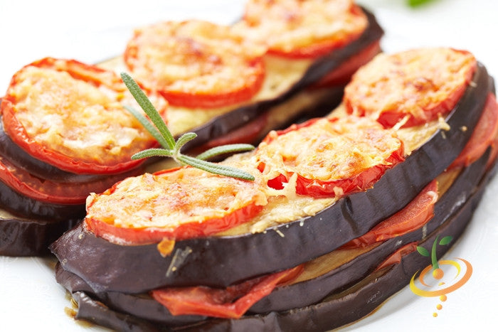Baked layered eggplant slices with tomato and melted cheese garnished with rosemary using Eggplant Florida Market seeds