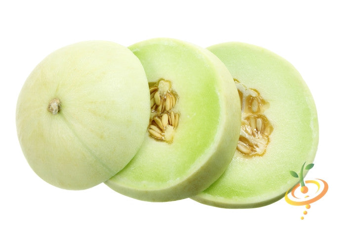 Whole and sliced honeydew melon with green flesh and seeds on white background
