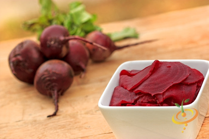 Early Wonder beet seeds from SeedsNow, showing vibrant green and purple beetroot seedlings on a gardening tray.