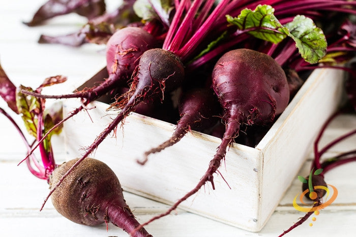 Fresh Early Wonder beet root from SeedsNow, showcasing vibrant red vegetables with green leafy tops.