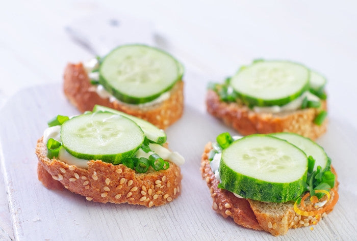 Tendergreen Burpless cucumber slices on sesame seed bread with green onions