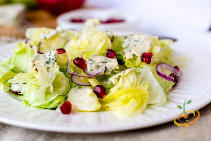 Iceberg lettuce seeds from SeedsNow, showing fresh green seeds for planting healthy iceberg lettuce.