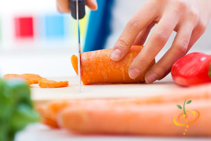 Danvers carrot seeds from SeedsNow, 7-inch long carrot variety, shown in a close-up image with fresh orange carrots and green tops.