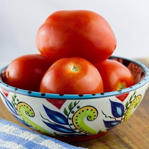 Tomato - Rutgers Seeds | Bright red medium-sized Rutgers tomatoes in a decorative bowl, showcasing smooth skin and slightly flattened shape.