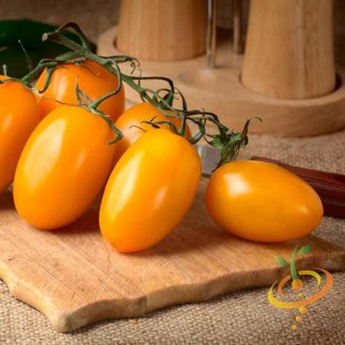 Yellow Pear Tomato Seeds | Cluster of ripe Yellow Pear Tomatoes on a wooden cutting board